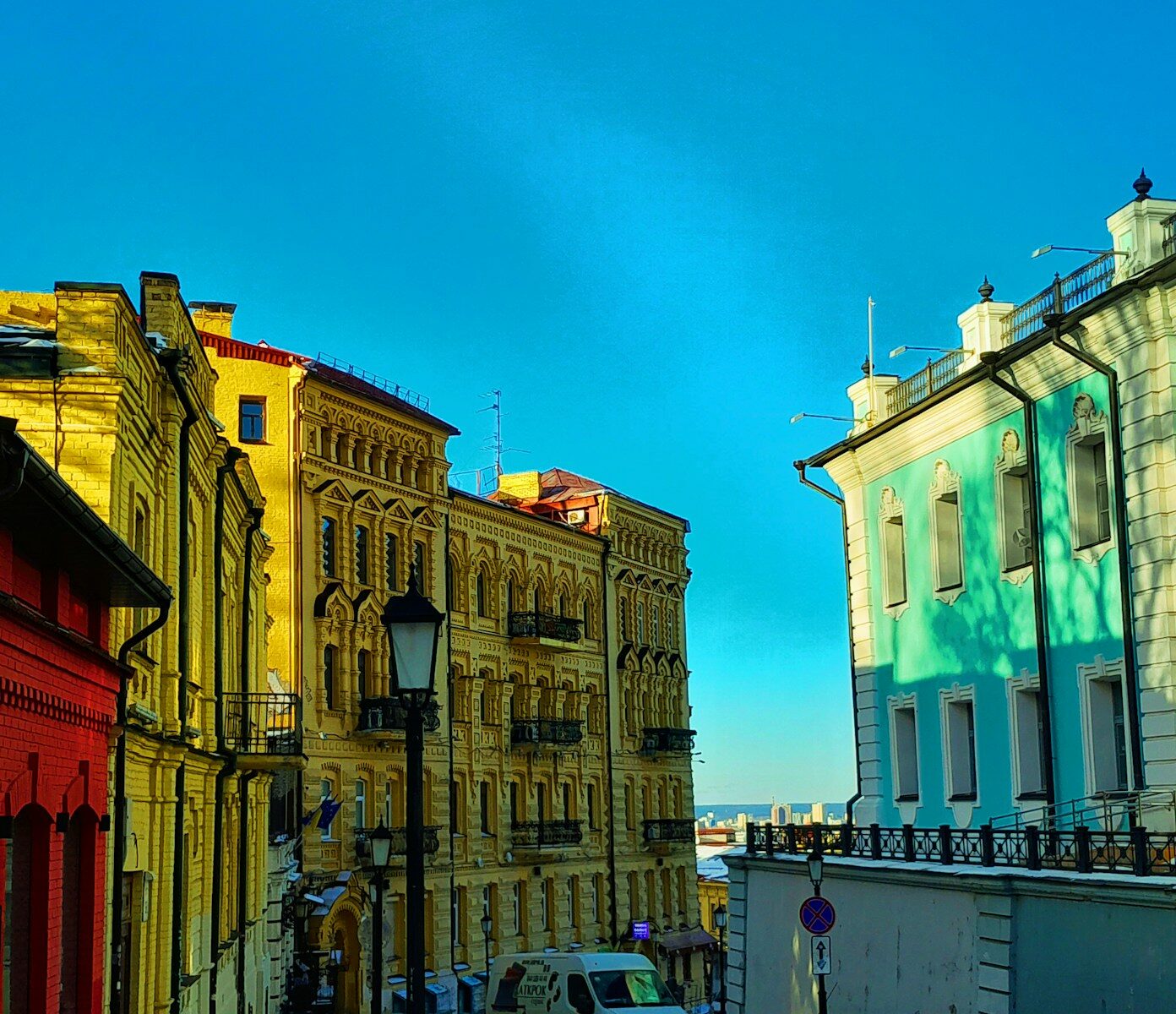 a row of buildings with a blue sky in the background